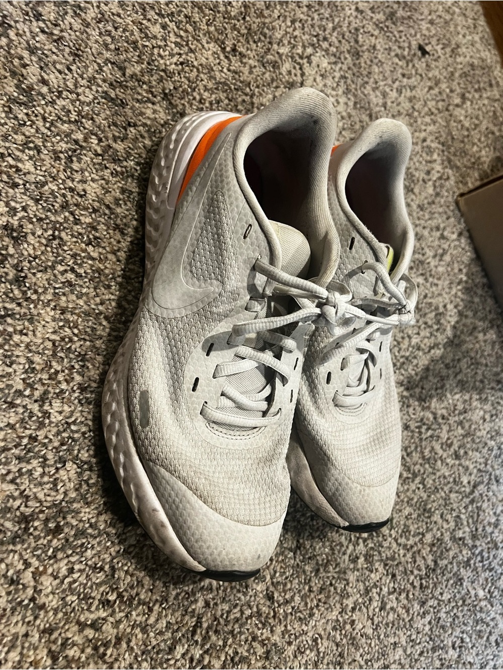 Nike Kids Light Gray Sneakers with Orange Heel Accent